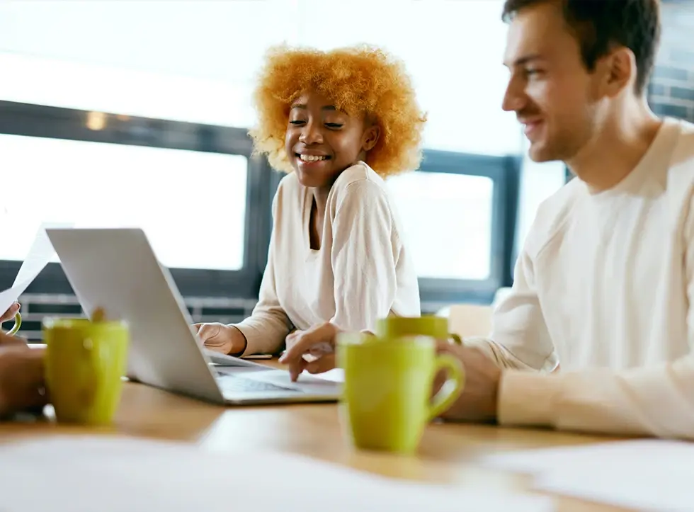 Three colleagues working in a modern office